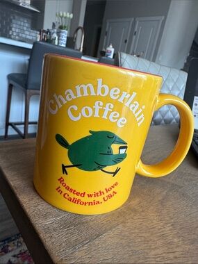 Bright Yellow Ceramic Mug with Green Bird Artwork